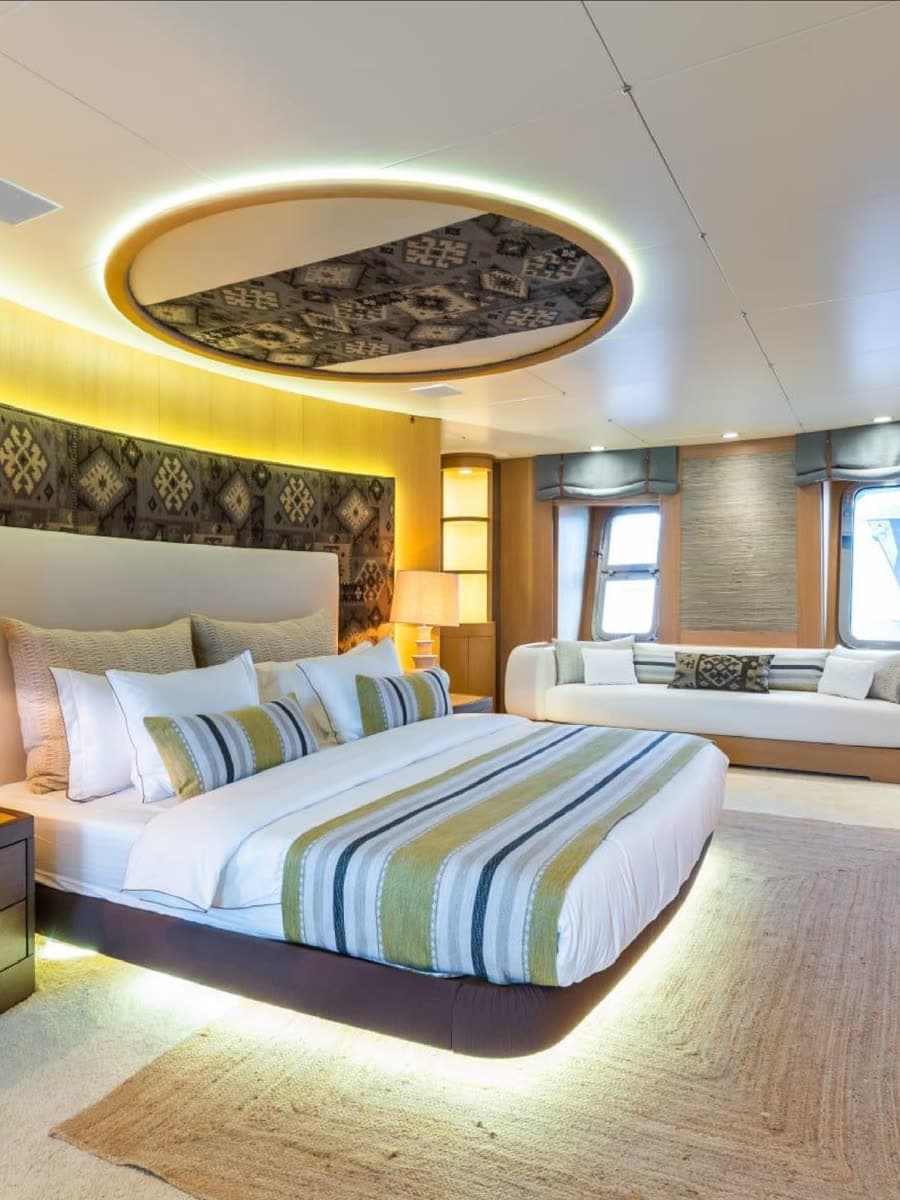A master suite in mahogany and soft light