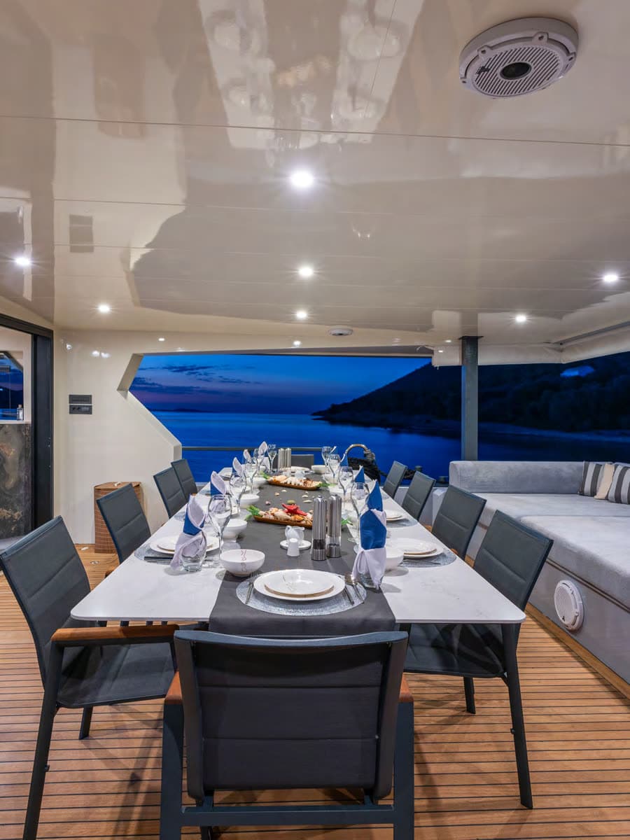 Alfresco dining on the aft deck at dusk