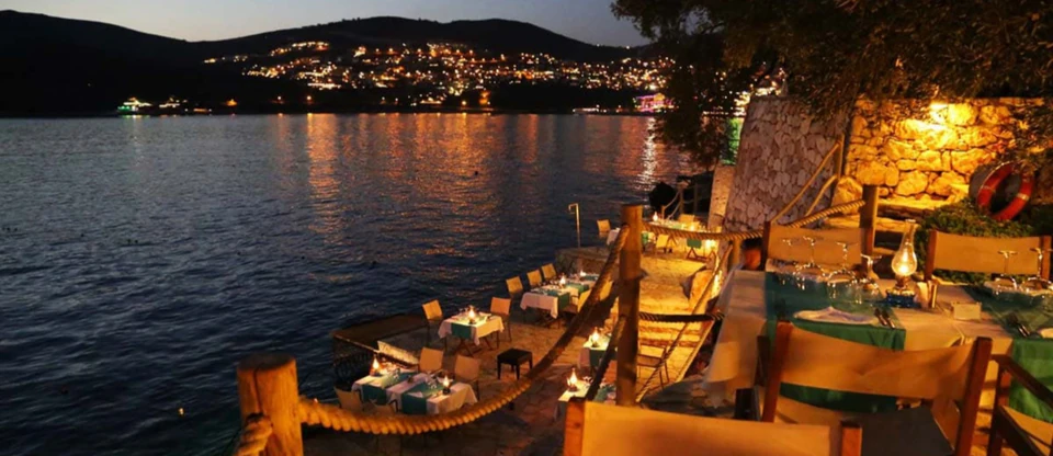 An open-air seaside restaurant serving Turkish mezes
