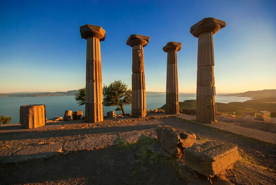 The Doric columns of the Temple of Athena at Assos, golden above the Aegean